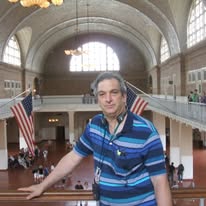 Dr. Alan Koslow at Ellis Island immigration hall
